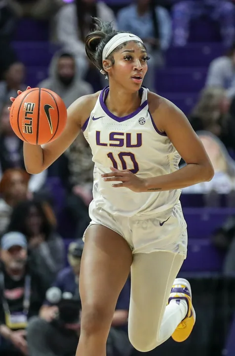 Angel Reese dribbling for LSU during a 2024 college basketball game