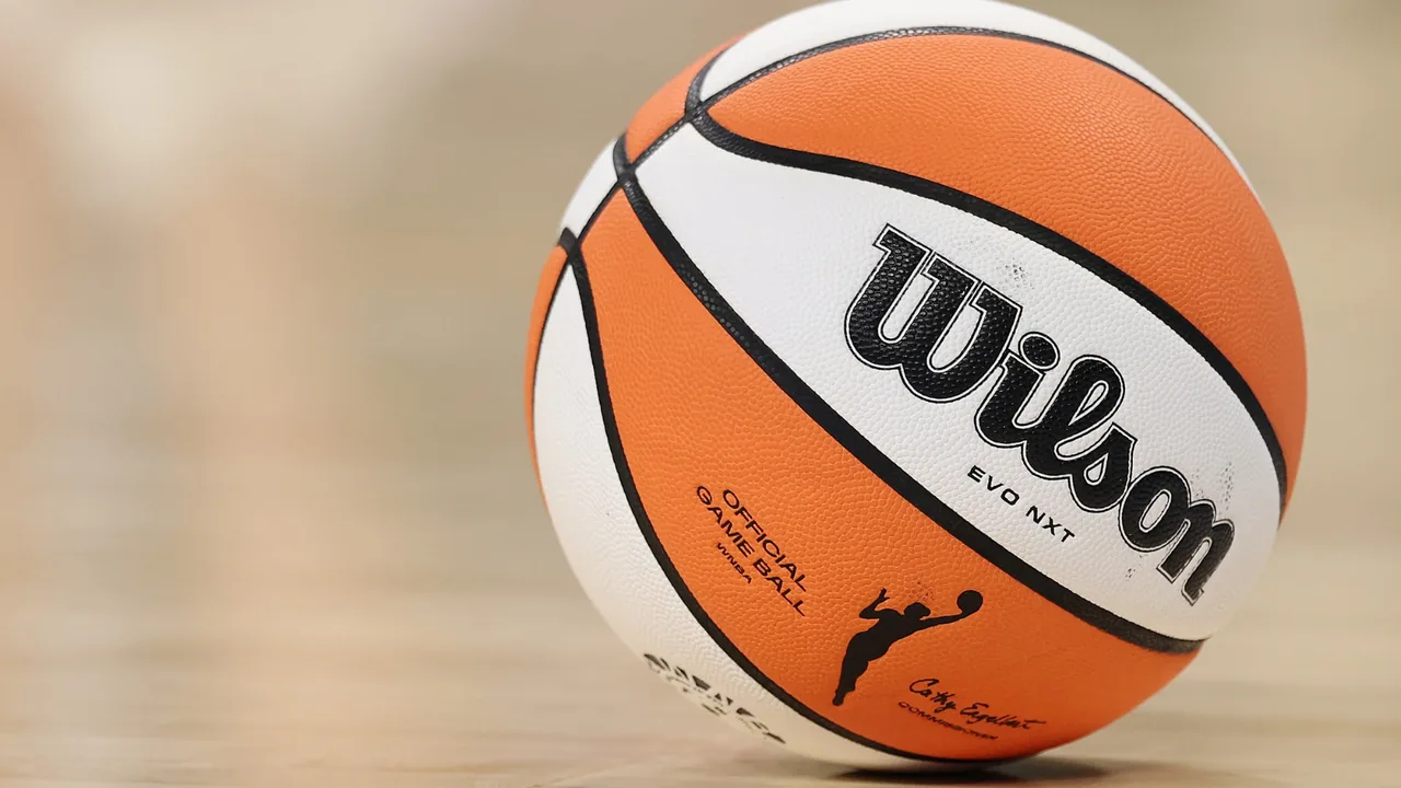Close-up of the orange-and-white Wilson official WNBA game ball